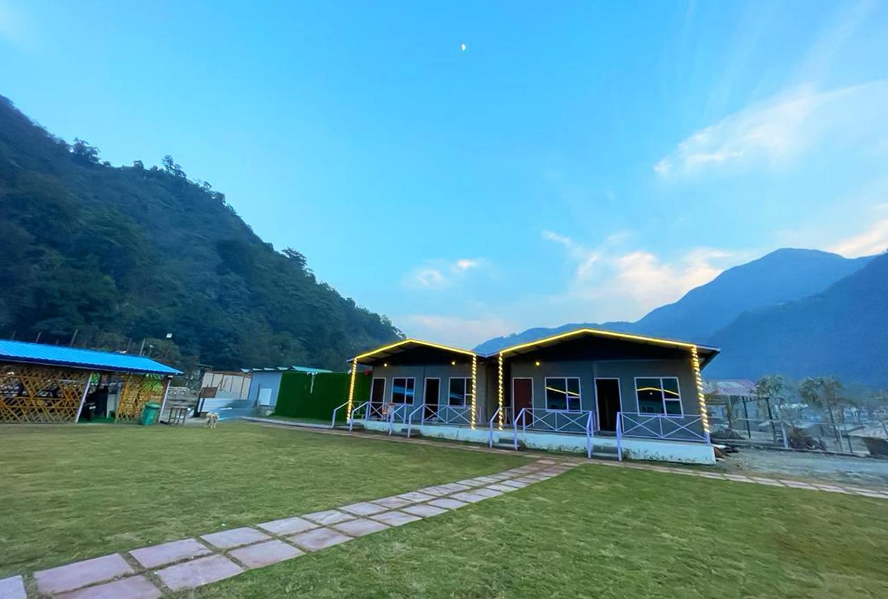 Morning view of riverside resort in Rishikesh surrounded by nature